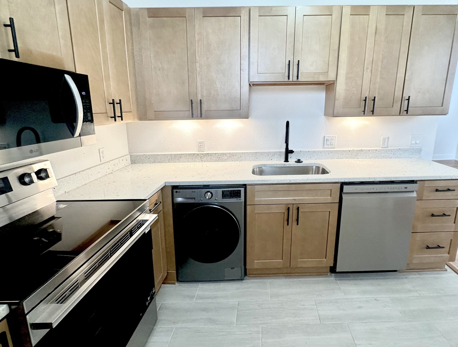 Renovated kitchen with LG stainless appliances and washer
