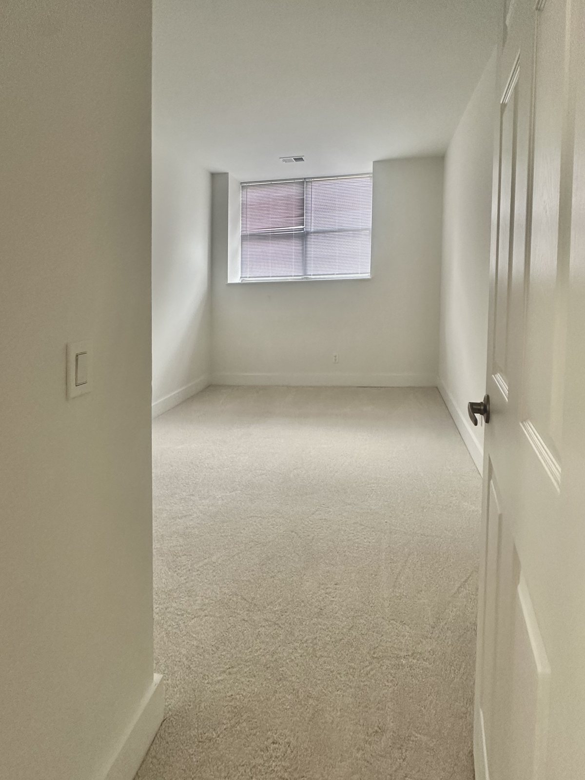 Bedroom with window and new carpet