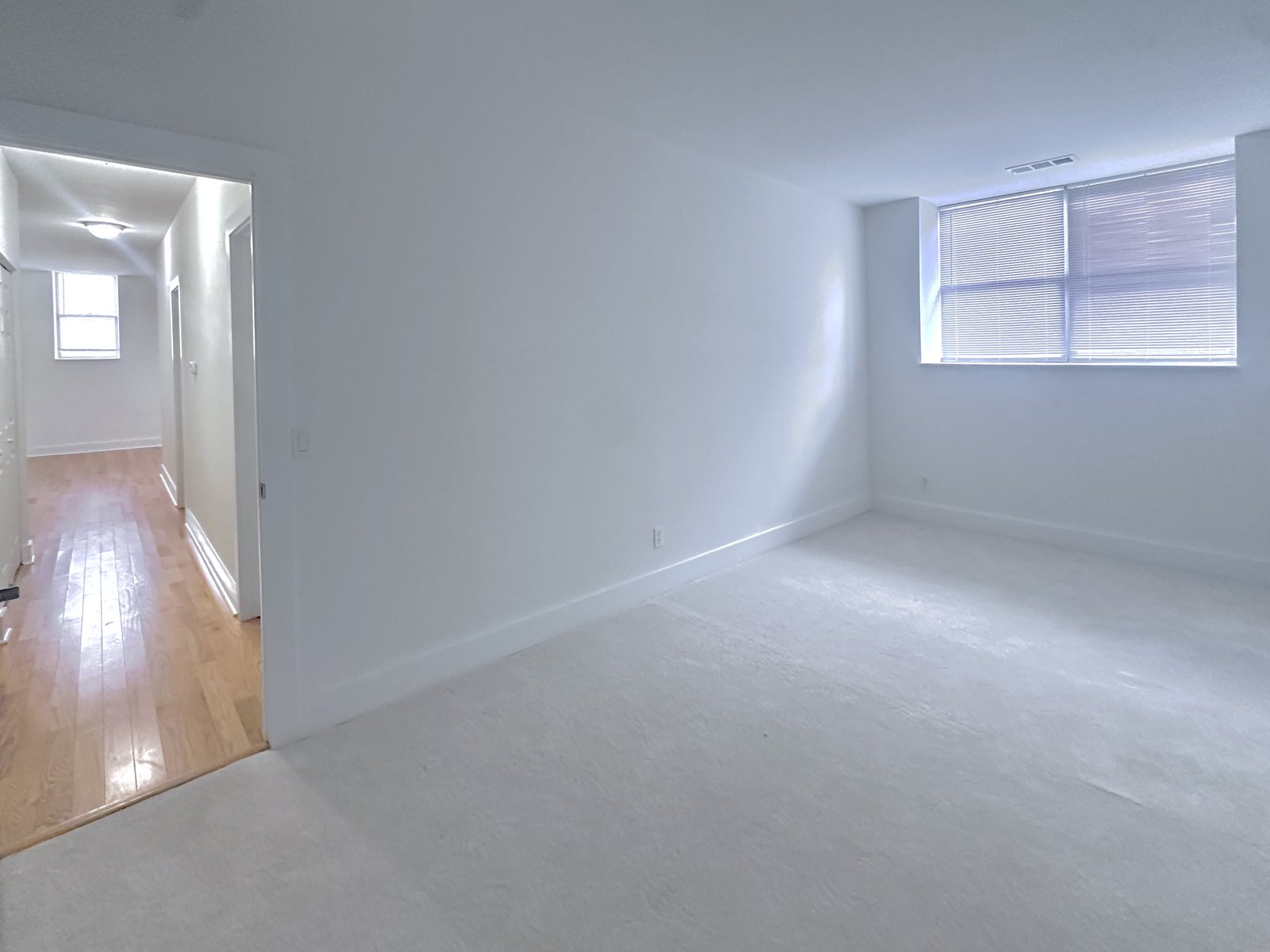 Living room with the hallway leading to the bedrooms