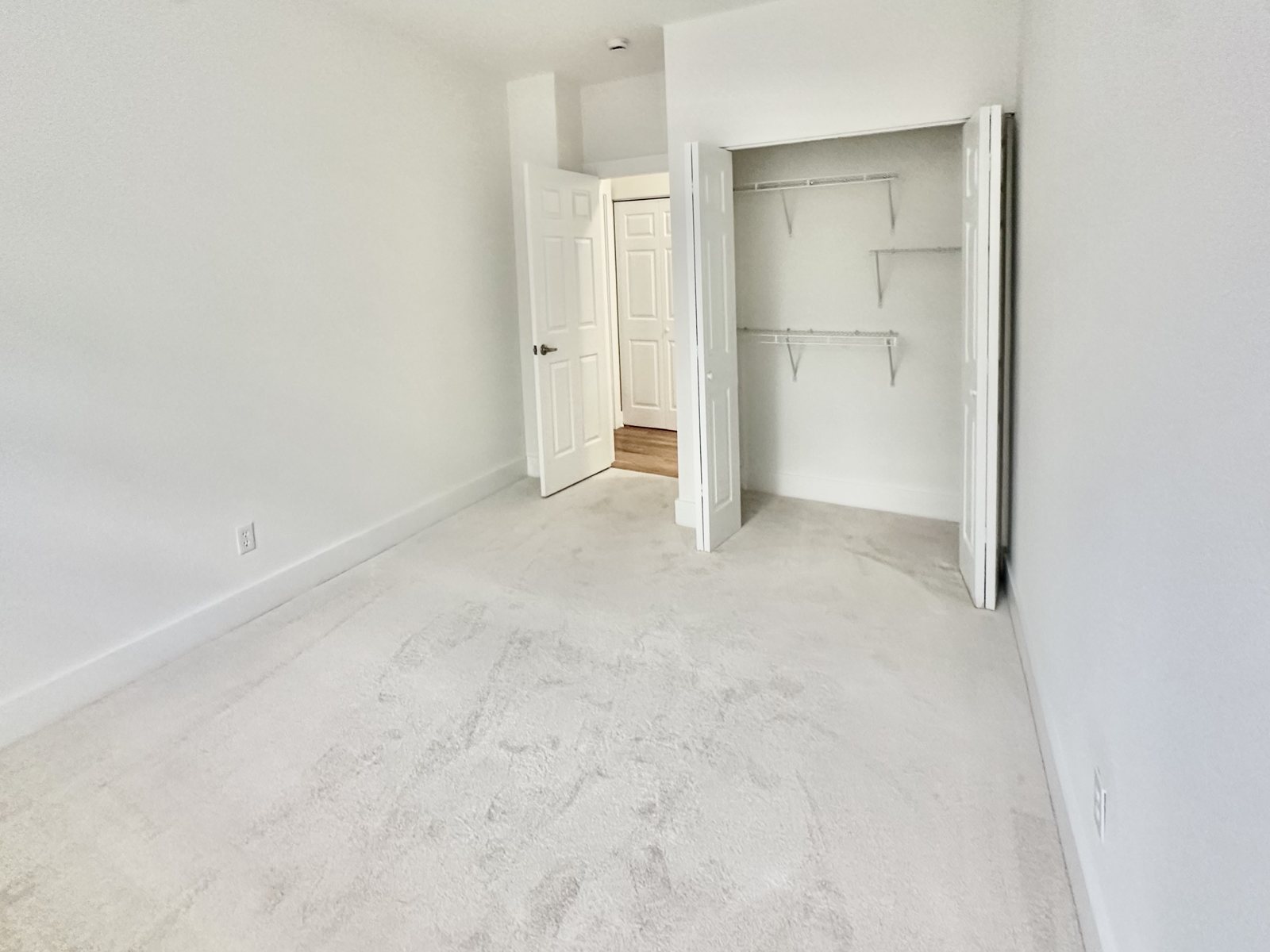 Bedroom with double-door closet